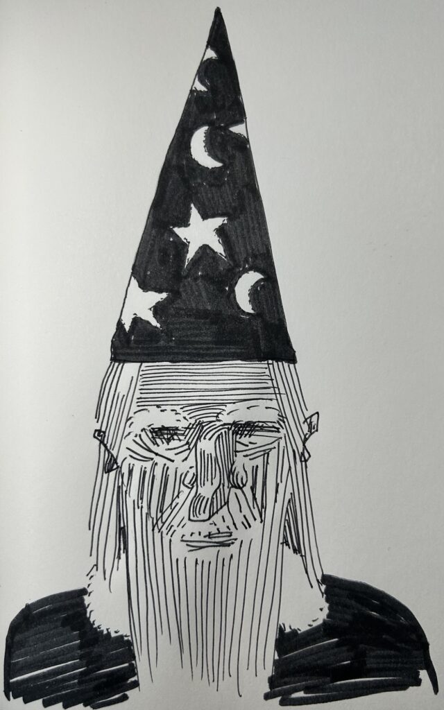 Ink drawing of a bearded wizard in a pointy hat with stars and moons.